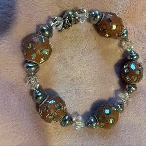 Elegant Silver and Brown Beaded Bracelet There’s 8 beautiful beaded bracelets